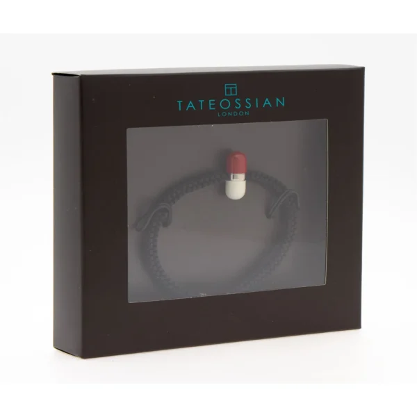 Tateossian black braided bracelet with red and white capsule charm in presentation box